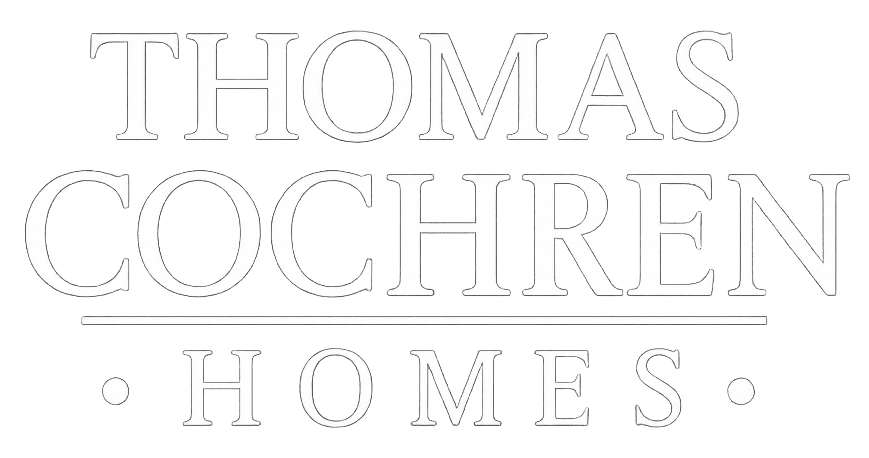 Thomas Cochren Homes logo on a transparent background.