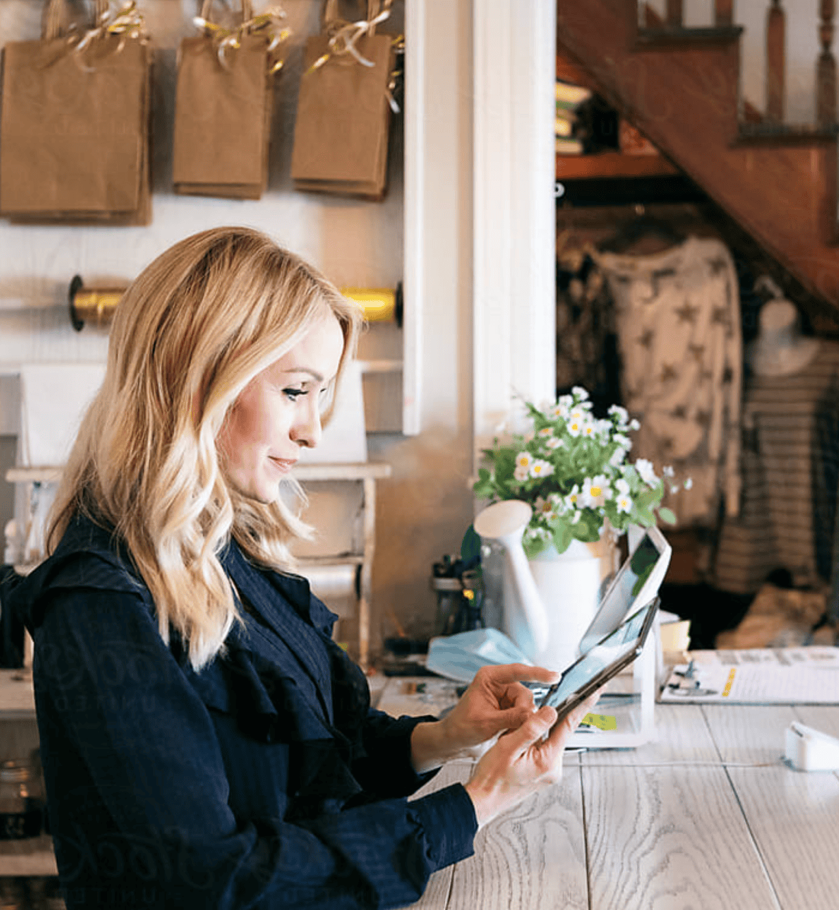 Smart woman browsing digital device at cozy cafe, emphasizing digital marketing and SEO services by Prestige Digital.